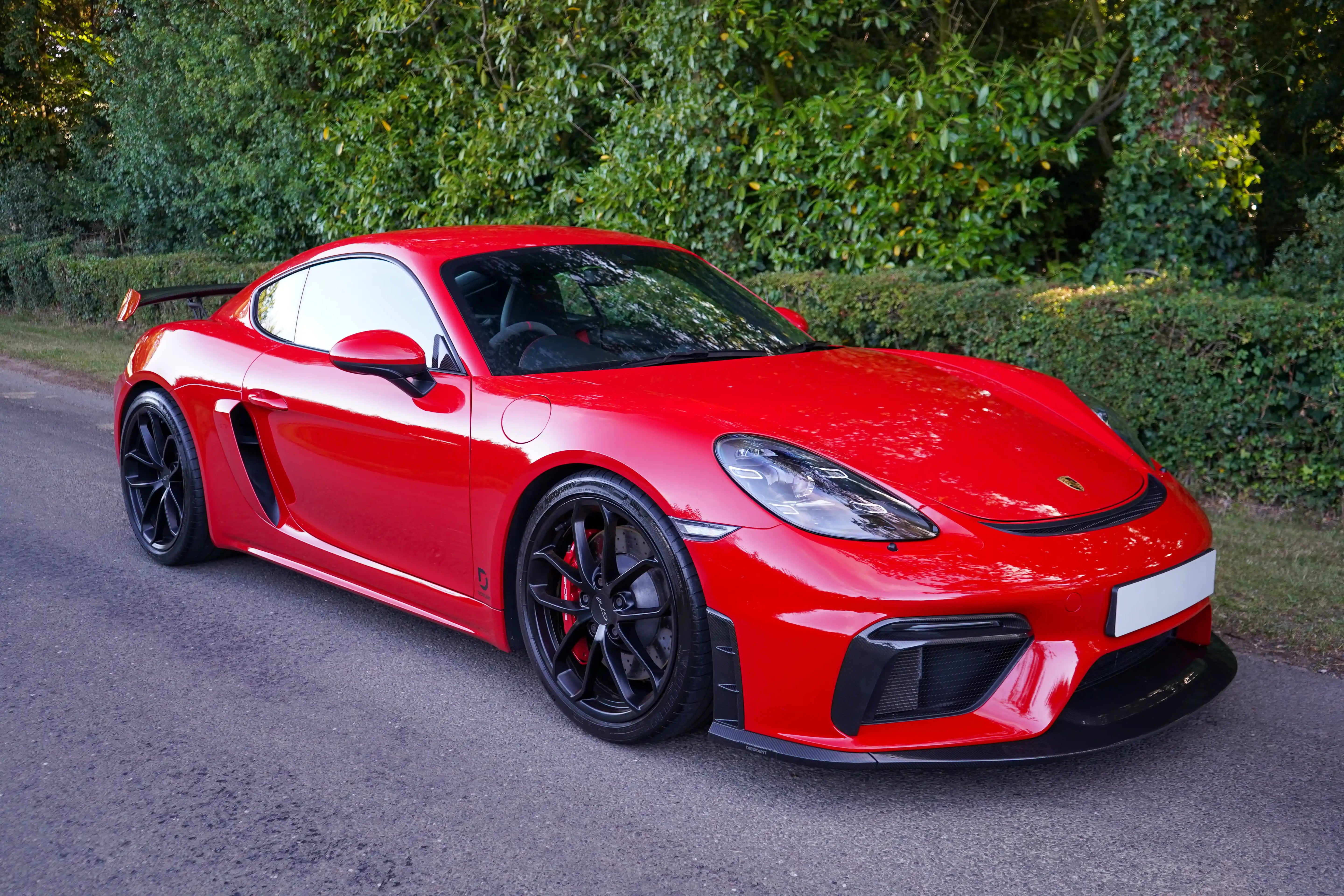 718 GT4 Front Splitter End / Vent Pair Visual Gloss Carbon Laquered