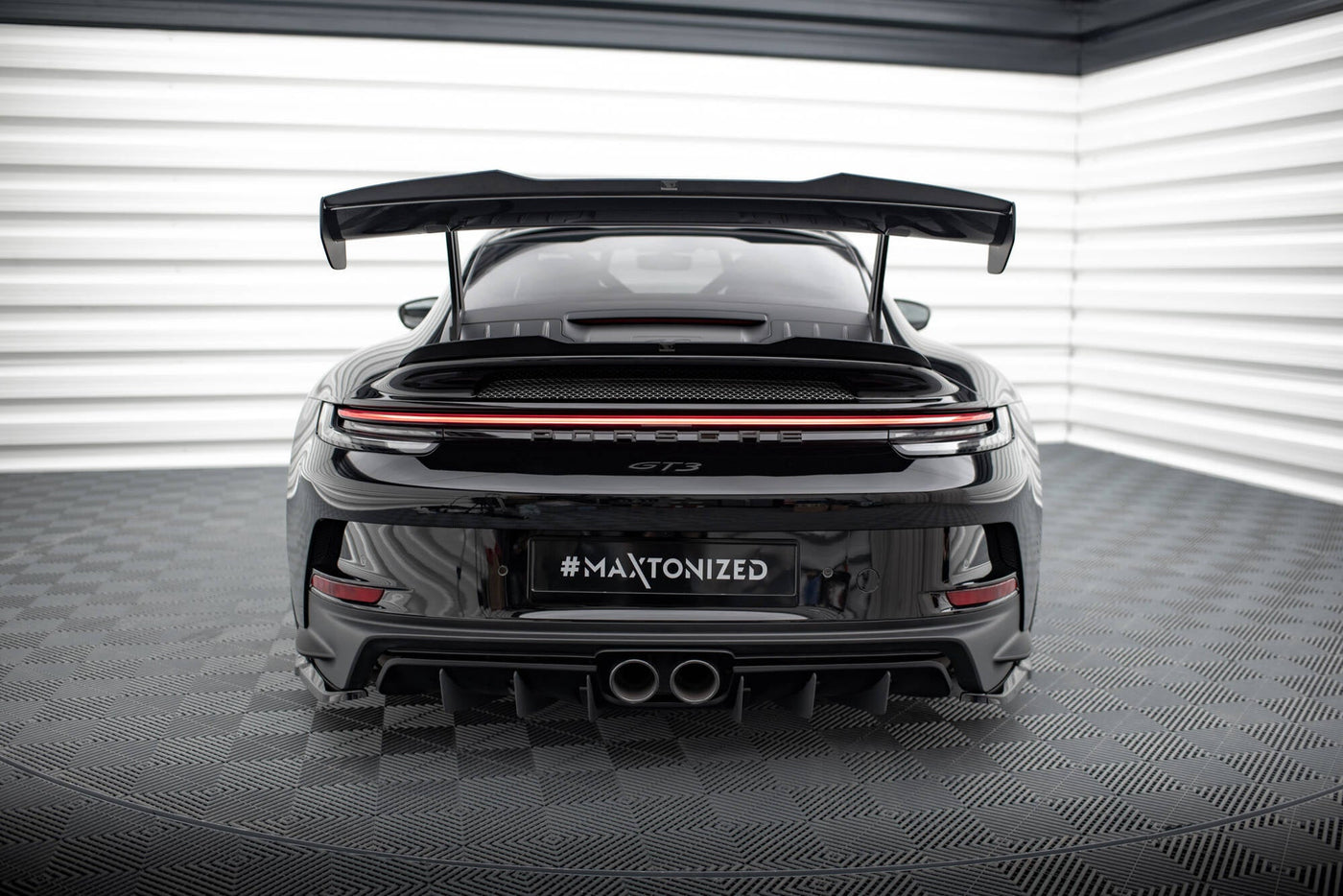 Porsche 911 992 GT3 gloss black lower spoiler cap, close-up