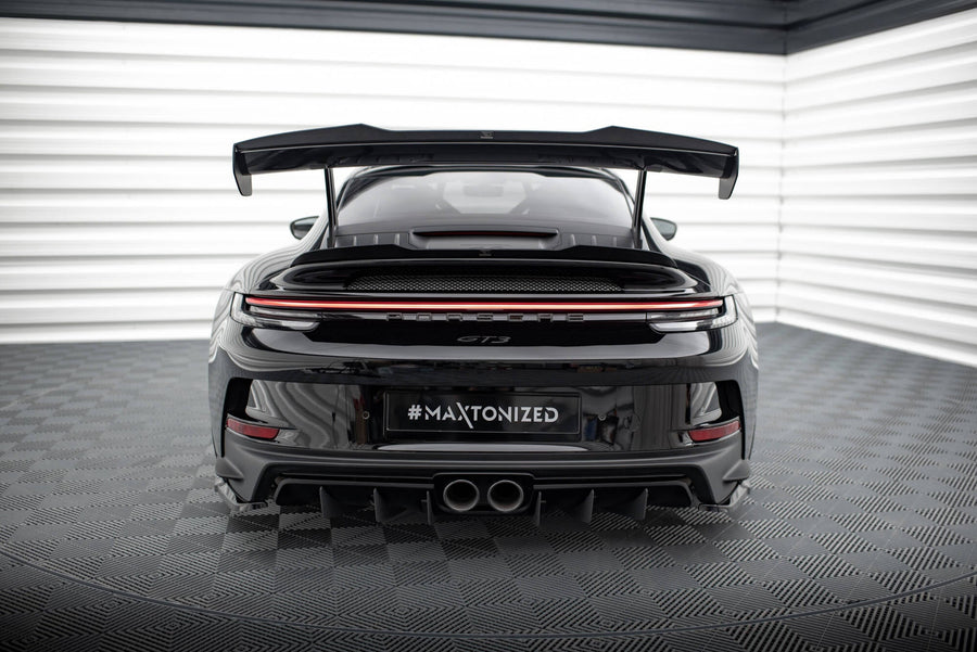 Porsche 911 992 GT3 gloss black lower spoiler cap, close-up