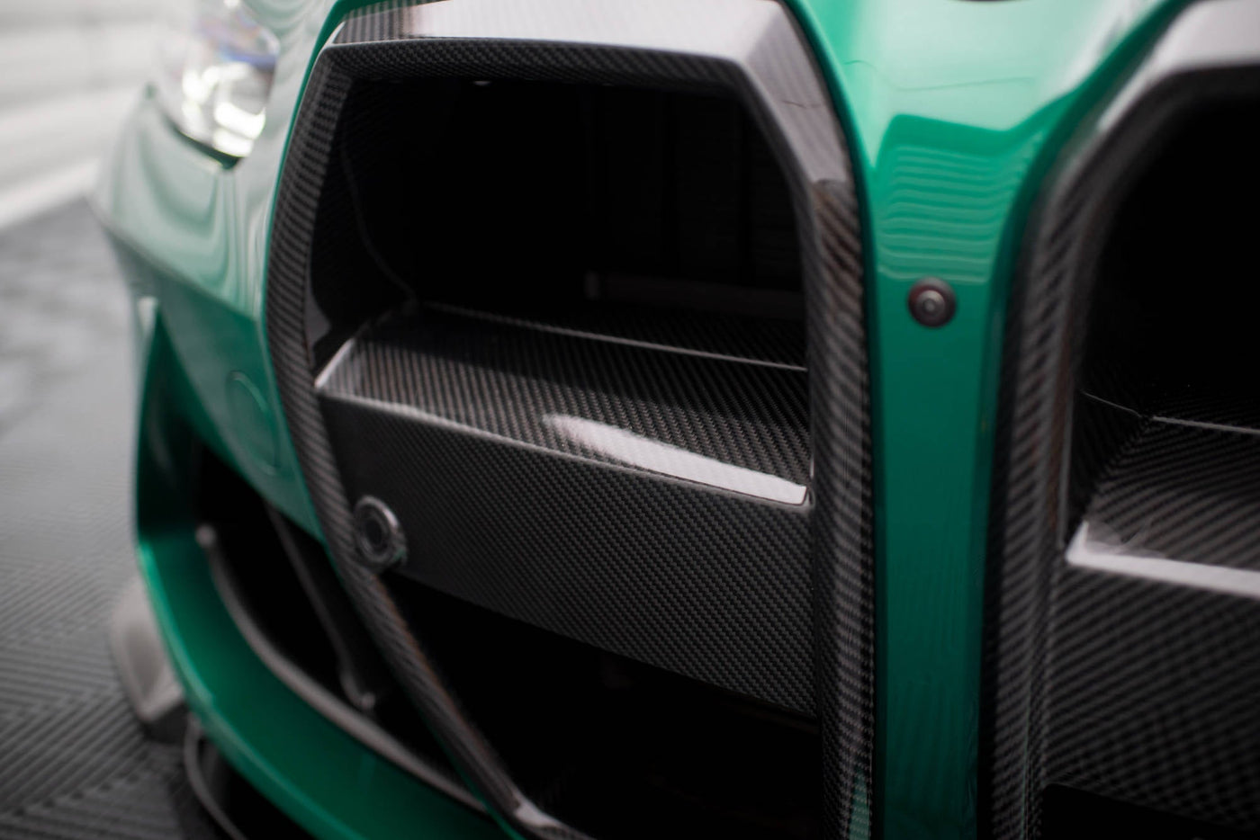 BMW M3 (G80) / M4 (G82) Carbon Fiber Front Grille — vehicle view
