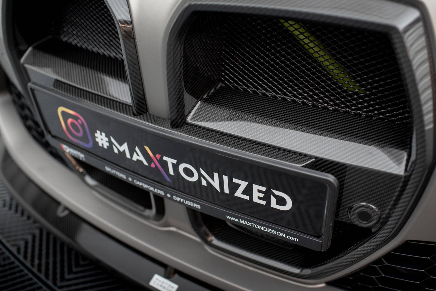 BMW M3 (G80) / M4 (G82) Carbon Fiber Front Grille — vehicle view