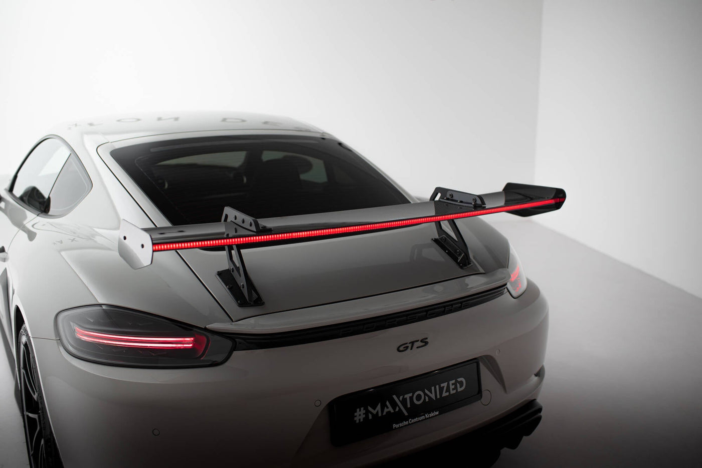 Porsche 718 Cayman Carbon Rear Wing — Swan Neck Mount — vehicle view (LED)